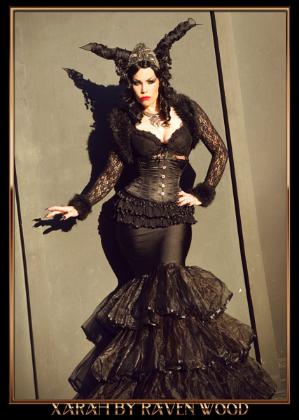 dark gothic queen Xarah von den Vielenregen in goth outfit with black dress, corset and horns headdress. Taken by Raven wood in Regensburg, Germany