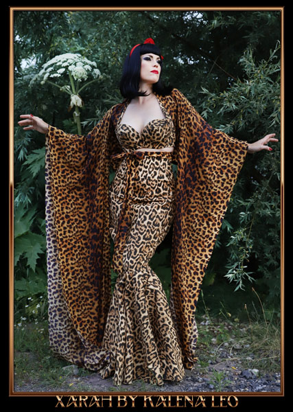 pinup model Xarah in retro Bettie Page look in gorgeous cheetah print leopard dress. Taken by Kalena Leo in Groningen, Netherlands